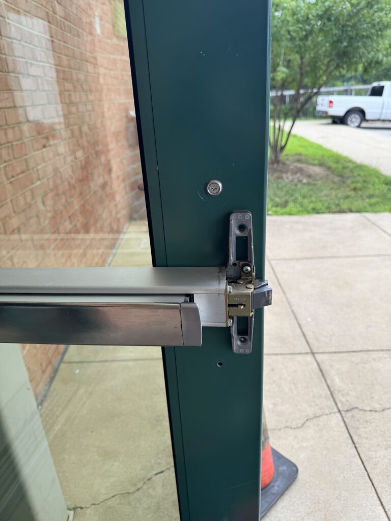 Commercial panic bar repair on a glass door in Northern Virginia