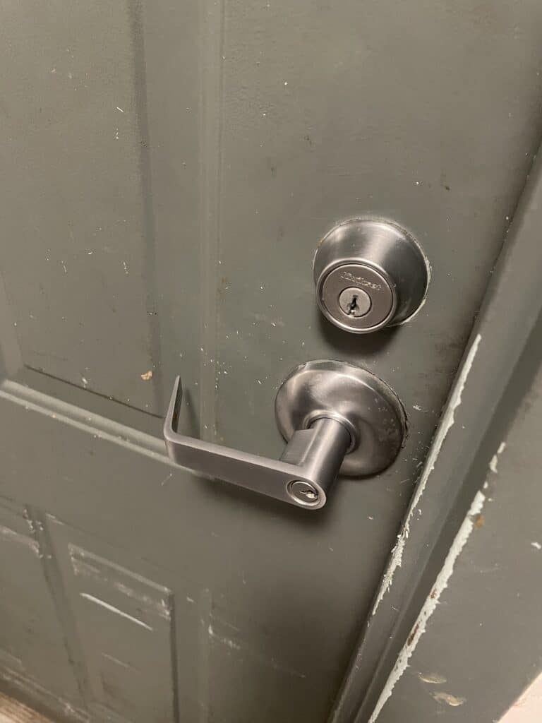 Kwikset deadbolt and keyed door handle on a residential door on Kennedy Lane in West Falls Church, VA.